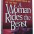 A woman rides the beast.jpg