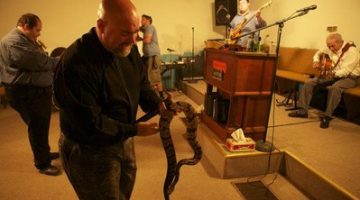 Pastor Jamie Coots in a snake handling service at his church